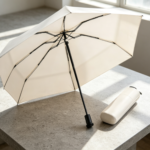 Minimalist Off-White Portable UV-Protection Umbrella – Reinforced Fiberglass Ribs, Foldable, with Storage Case